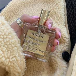 NUXE - VAJ MULTI-FUNKSIONAL HIDRATUES, USHQYES & ZBUTES PER FLOKET, FYTYREN & TRUPIN "HULIE PRODIGIEUSE - 50ML